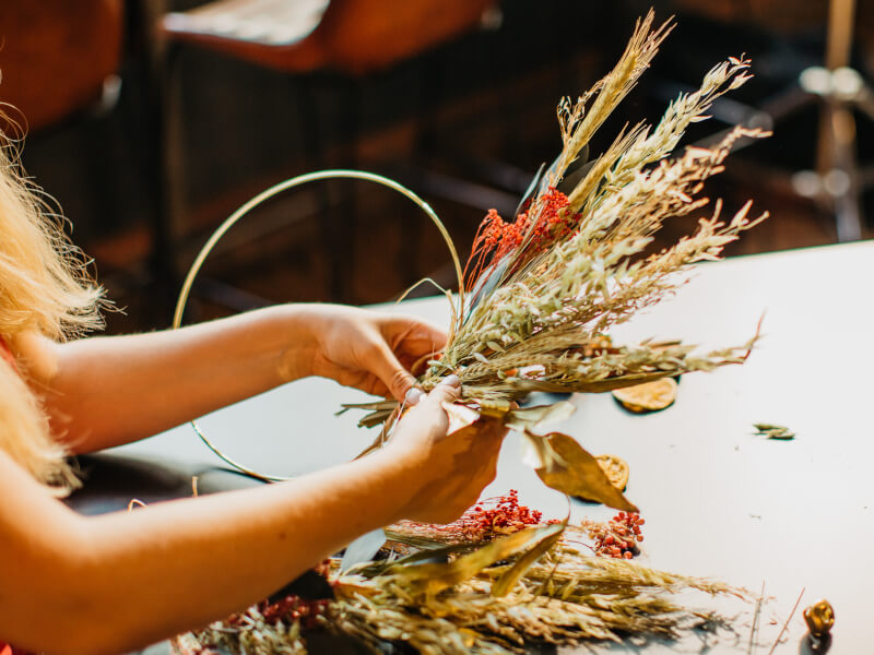 woman making a Christmas wreath